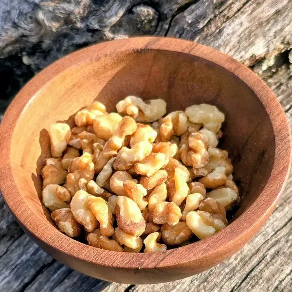 Whole and halved walnuts